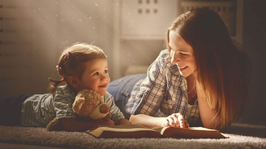 mother and daughter while reading a book